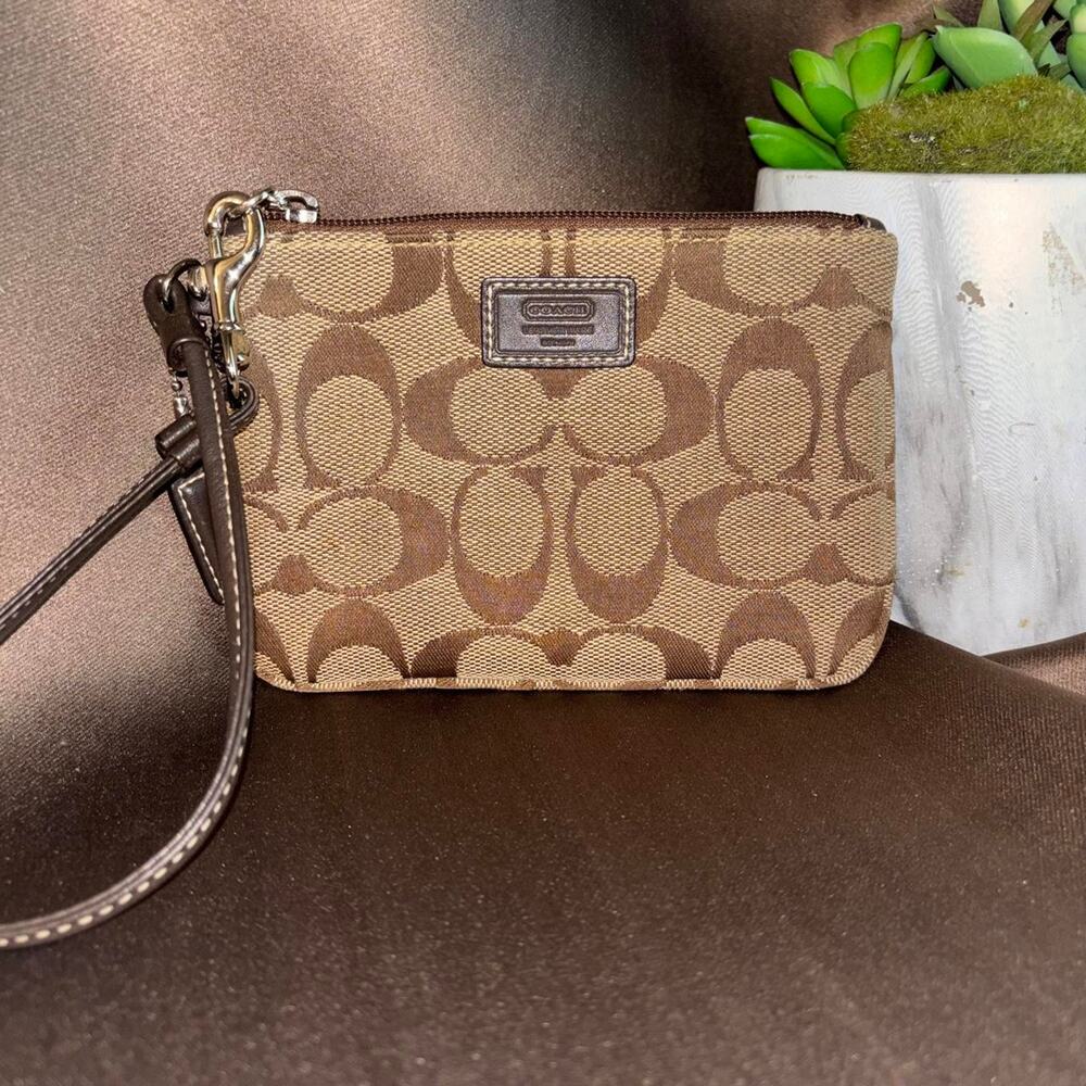 Coach brown and beige signature wristlet, minor wear but no major callouts